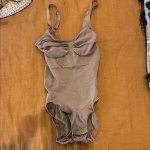 Skims One-Piece Bodysuit in Taupe